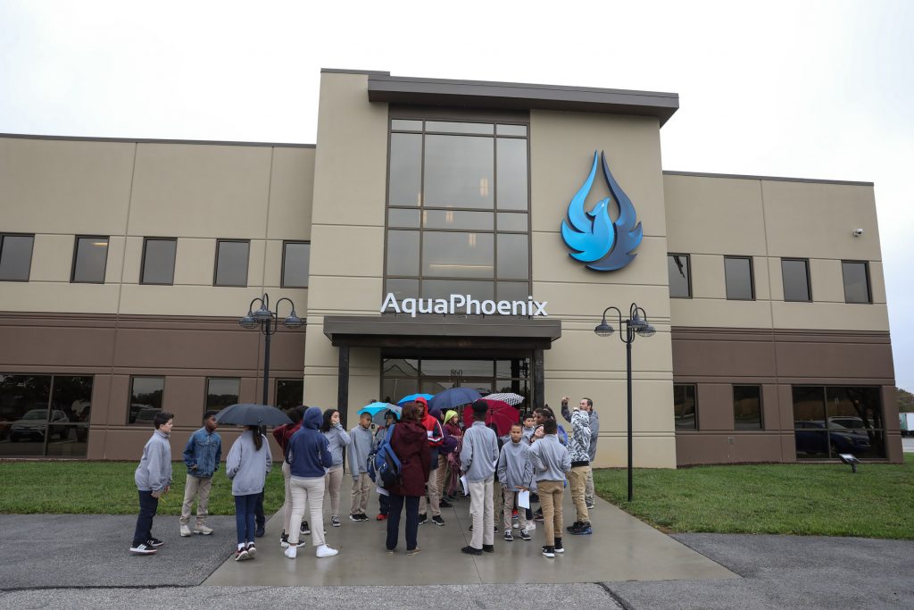 group of school students outside of the AquaPhoenix facilities