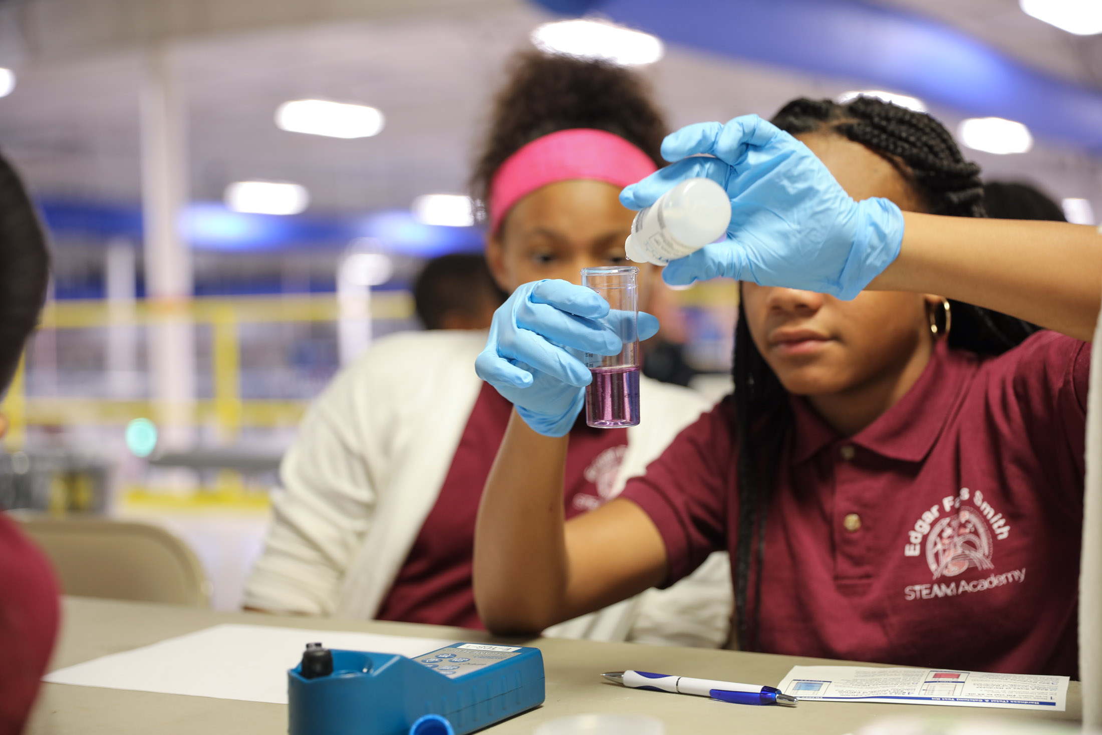 STEM Academy students conducting a test using testing kits at the AquaPhoenix headquarters